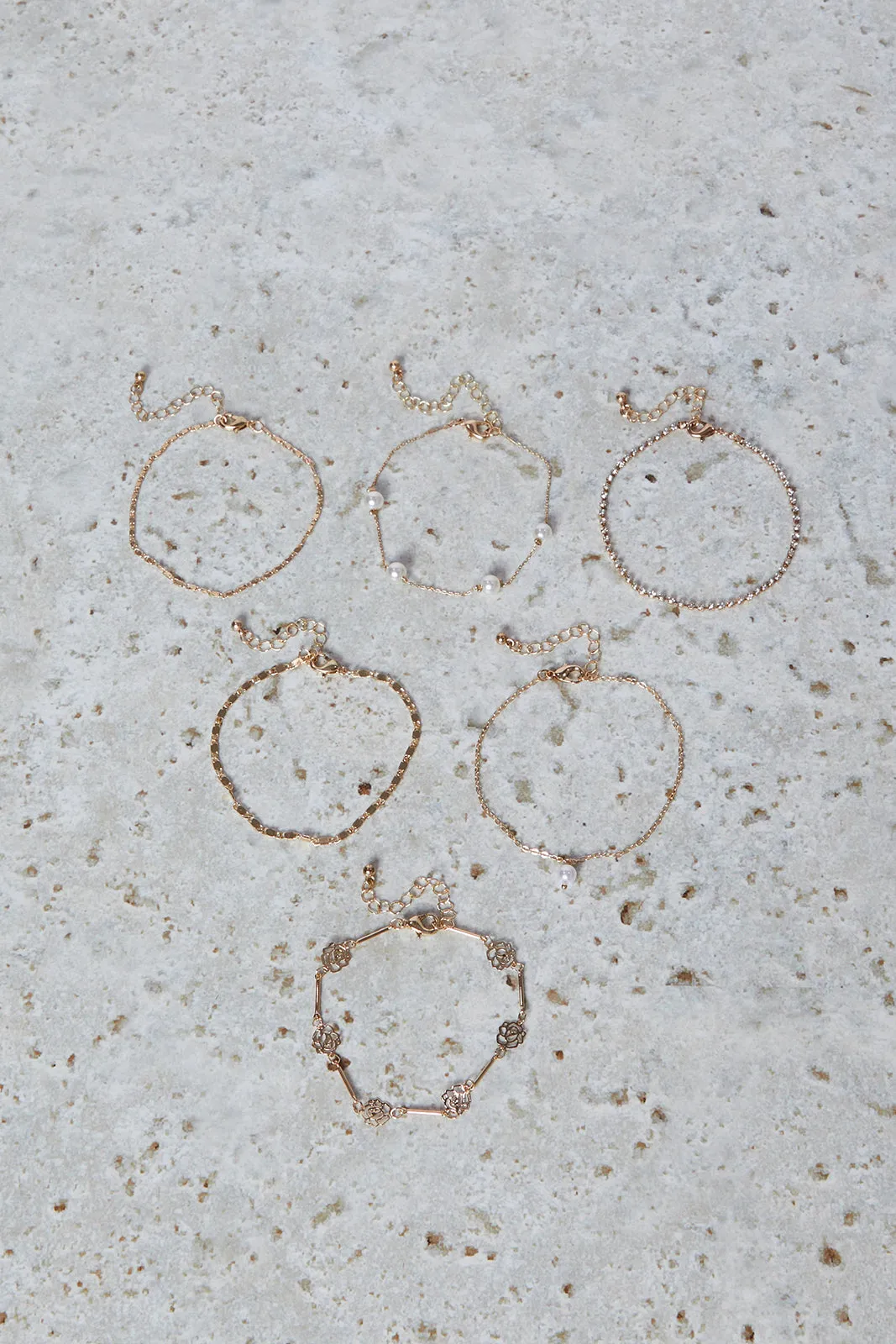 Women Gold Embellished Bracelet Set (Pack of 6) sold by Redtag