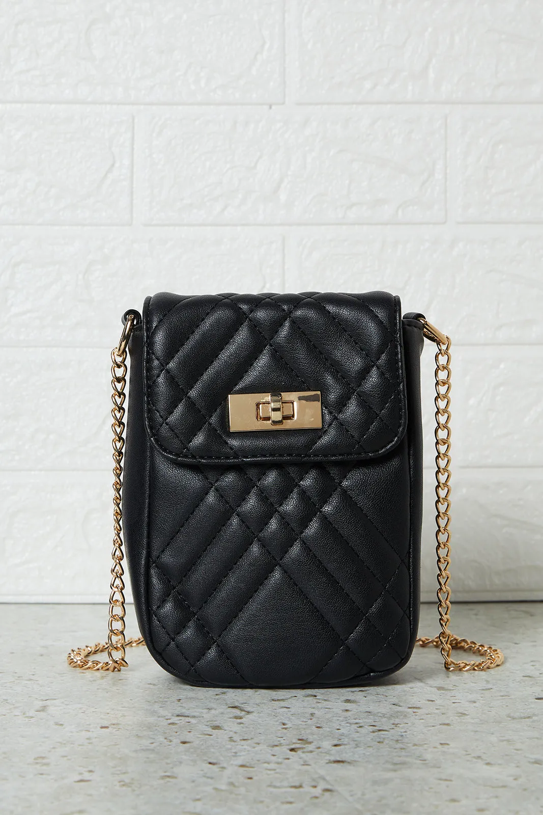 Black Quilted Ladies Mobile Sling sold by Redtag