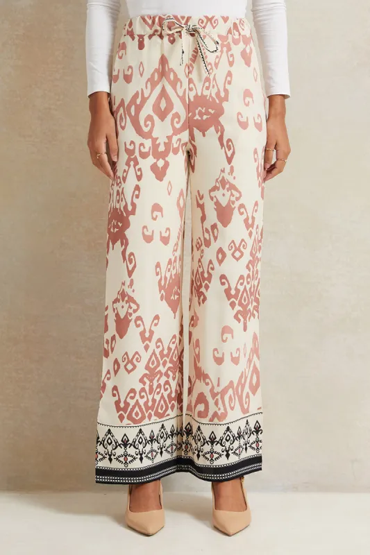 Women Cream Printed Wide Leg Trousers sold by Redtag