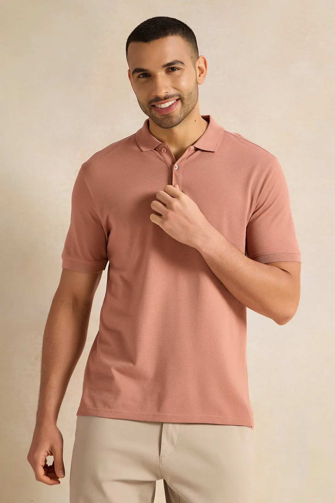Men Pink Solid Polo Shirt sold by Redtag
