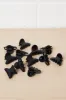 Women Black Butterfly Hair Claw Set 12(Piece) sold by Redtag