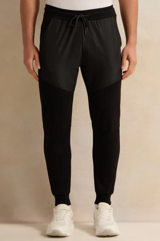 Men Black Solid Active Pants sold by Redtag