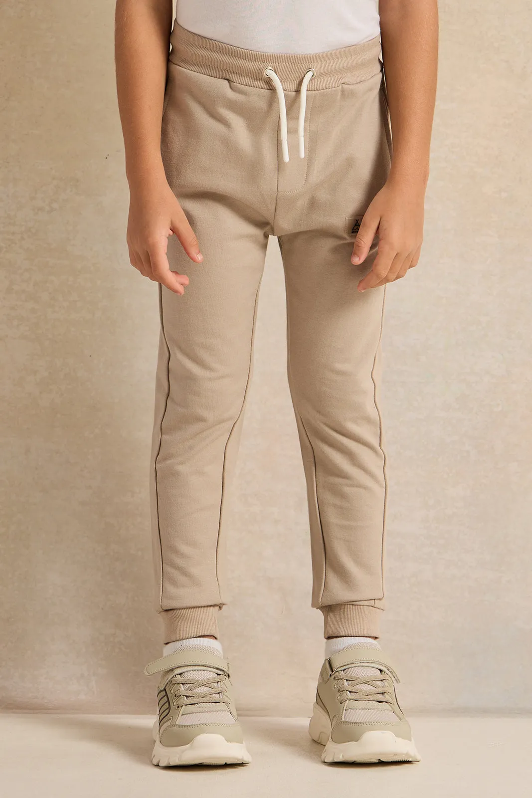 Boys Beige Printed Track Pants sold by Redtag