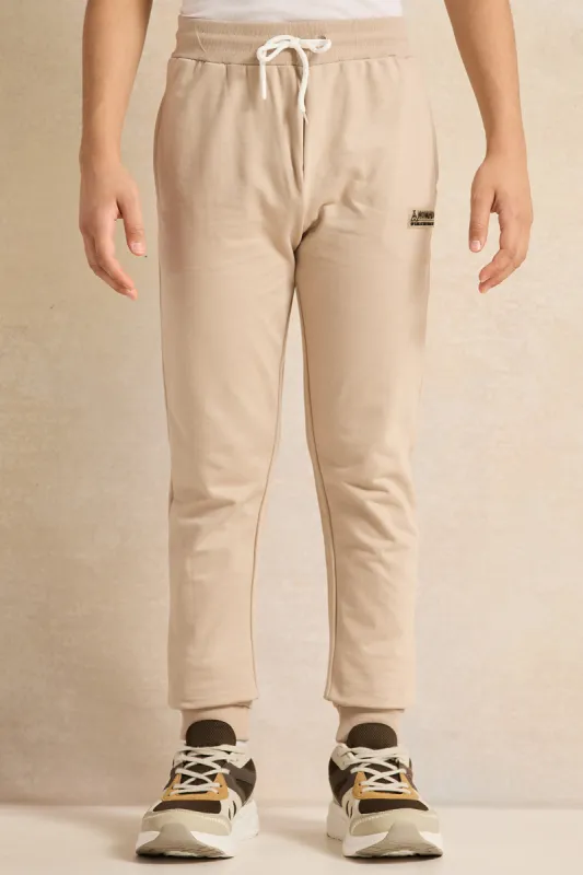 Senior Boys Beige Basic Track Pants sold by Redtag