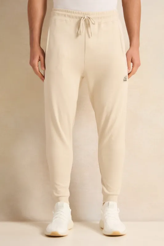Men Beige Pleated Interlock Lounge Active Pants sold by Redtag
