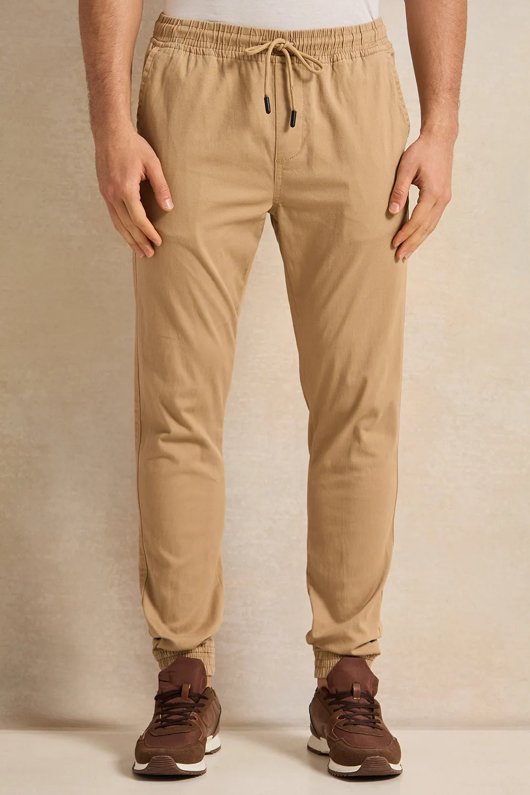 Men Beige Solid Joggers sold by Redtag