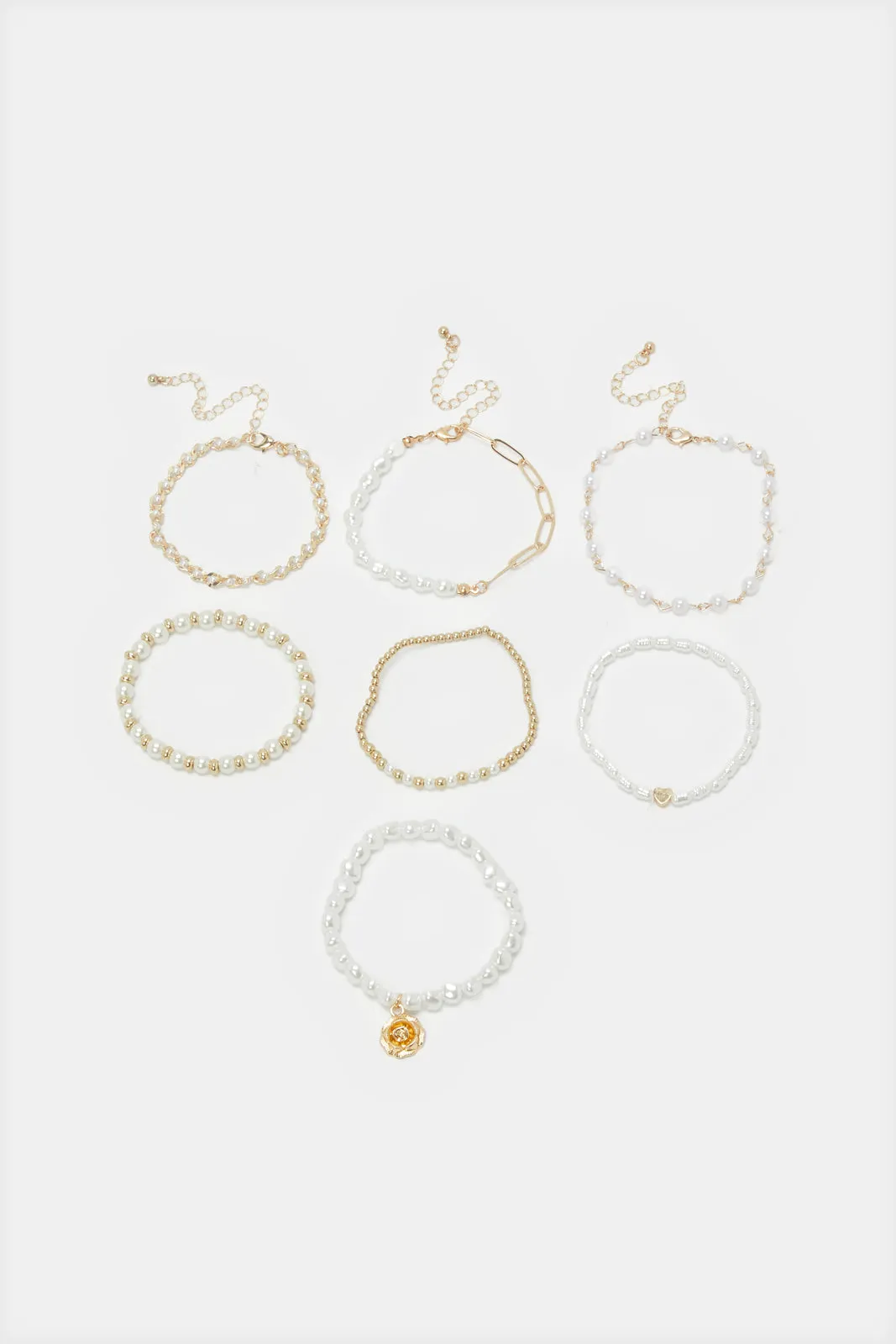 Women Gold Embellished Bracelets Set (7 Piece) sold by Redtag