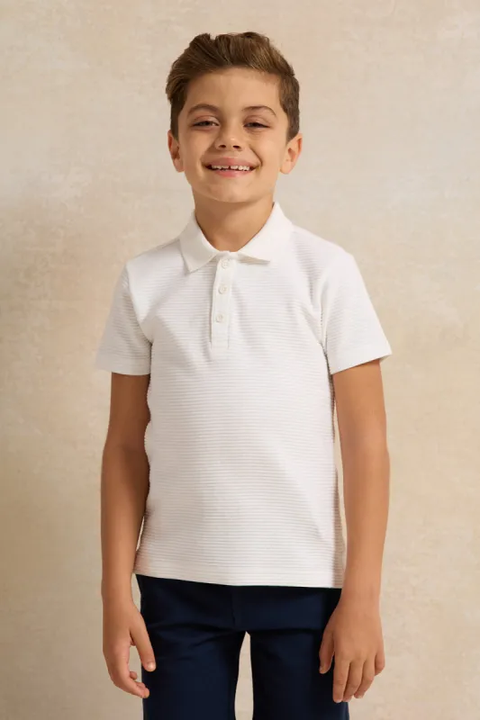 Boys White Ribbed Polo Shirt sold by Redtag