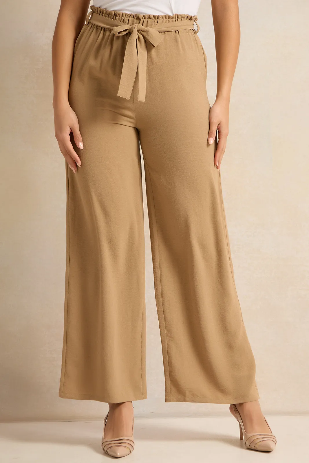Women Tan Belted Flared Trousers sold by Redtag