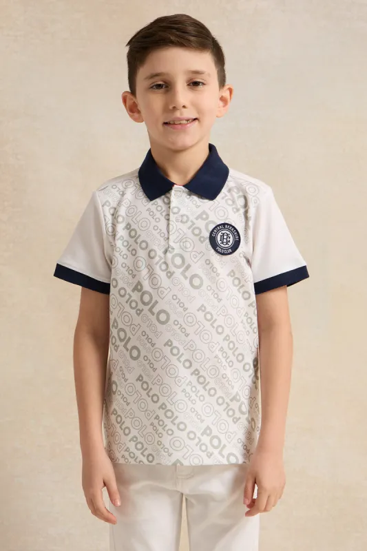 Boys White And Navy Printed Polo Shirt sold by Redtag