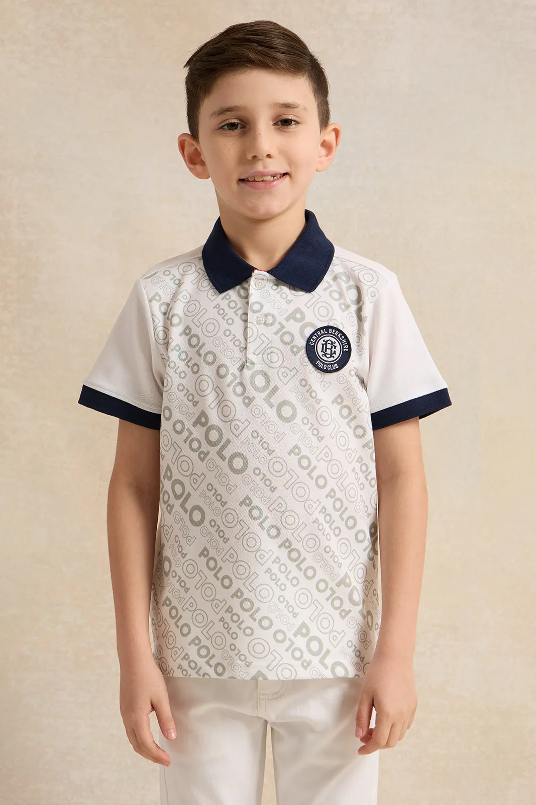 Boys White And Navy Printed Polo Shirt sold by Redtag