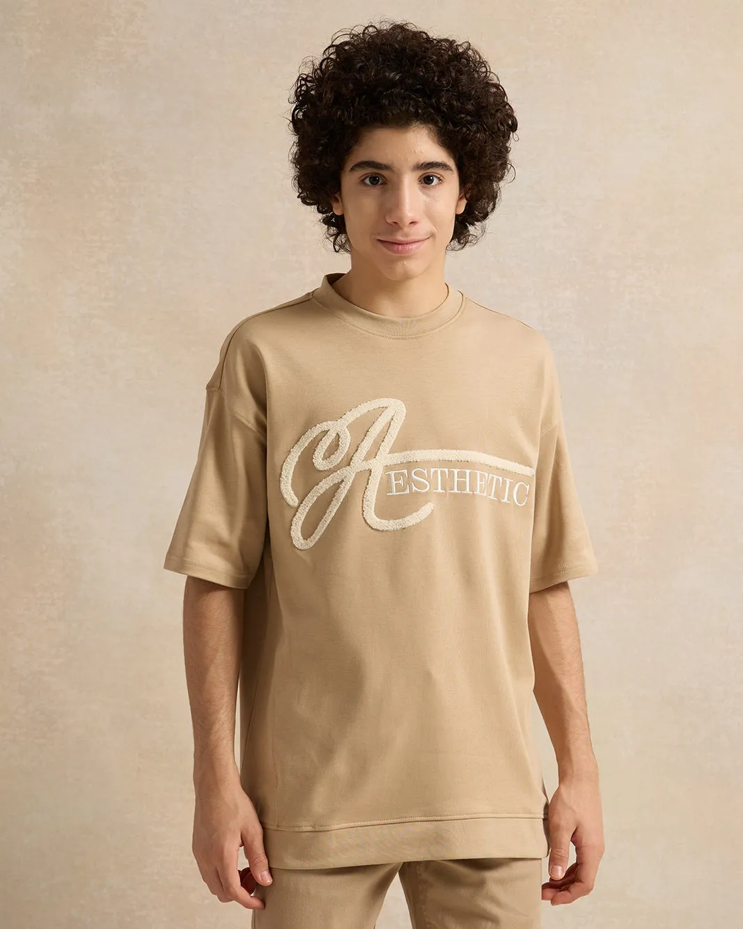 Senior Boys Beige Embellished T-Shirt sold by Redtag