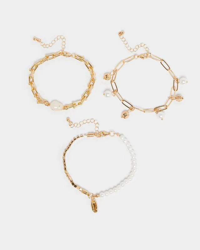 Women Gold Pearl Embellished Bracelet Set (3 Piece) sold by Redtag
