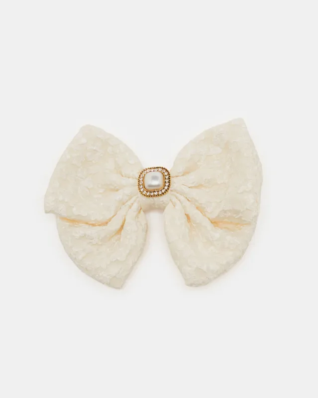 Women White Embellished Hair Claw sold by Redtag