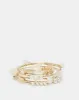 Women Gold Embellished Coil Bracelet sold by Redtag
