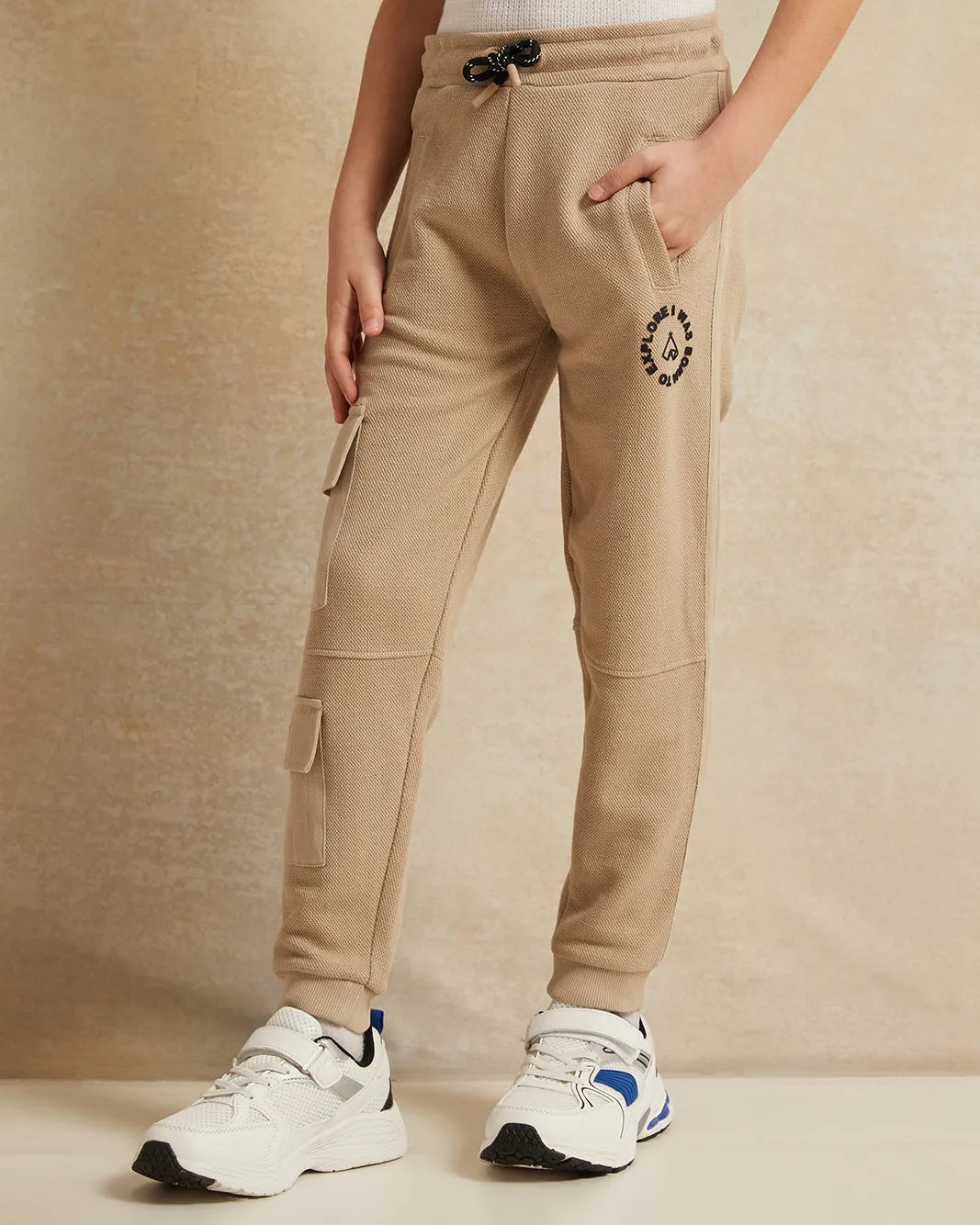 Boys Beige Printed Track Pants sold by Redtag