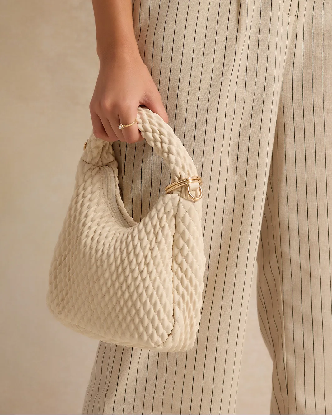 Women Beige Quilted Messenger Bag sold by Redtag