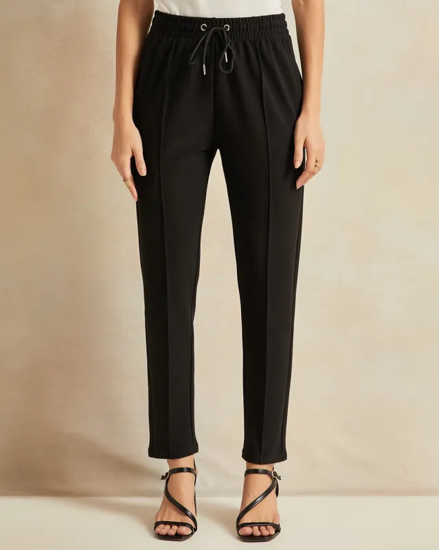 Women Black Tapered Trousers sold by Redtag