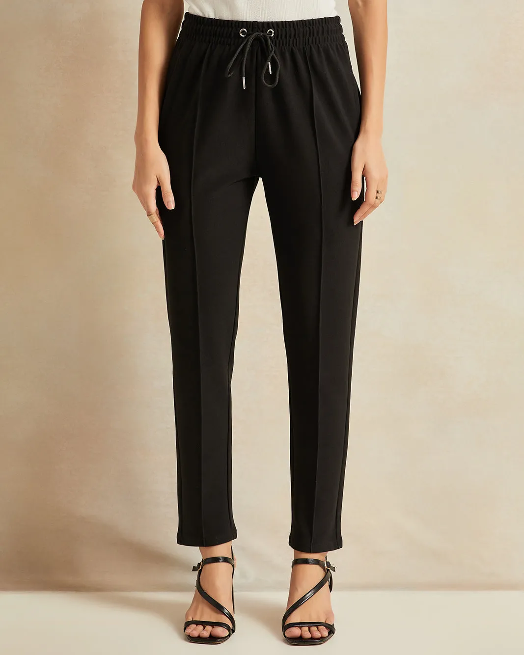 Women Black Tapered Trousers sold by Redtag