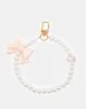 Women White Embellished Key Ring sold by Redtag