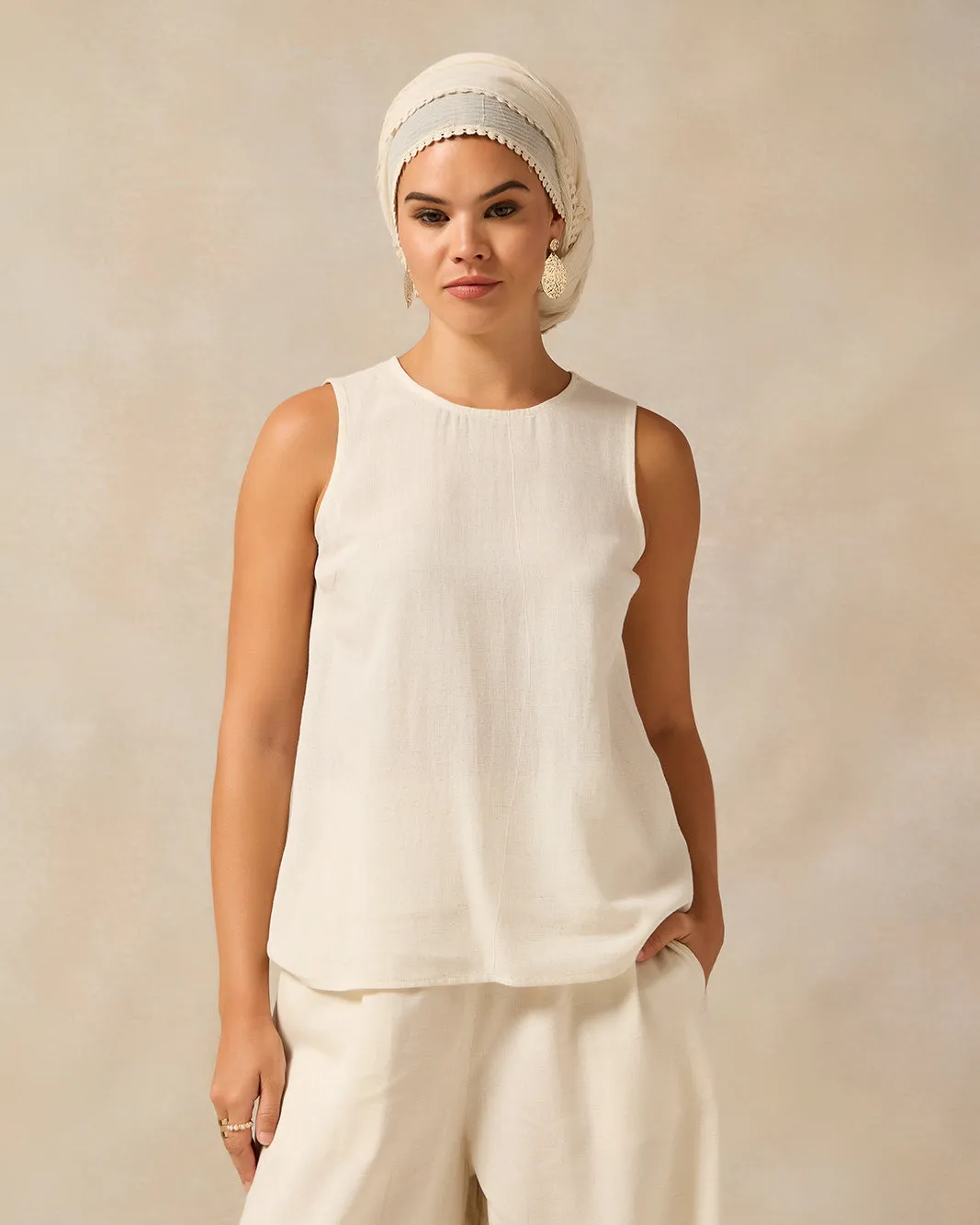 Women Ivory Sleeveless Blouse sold by Redtag