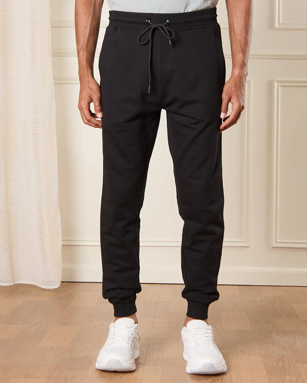 Men Black Solid Active Pants sold by Redtag