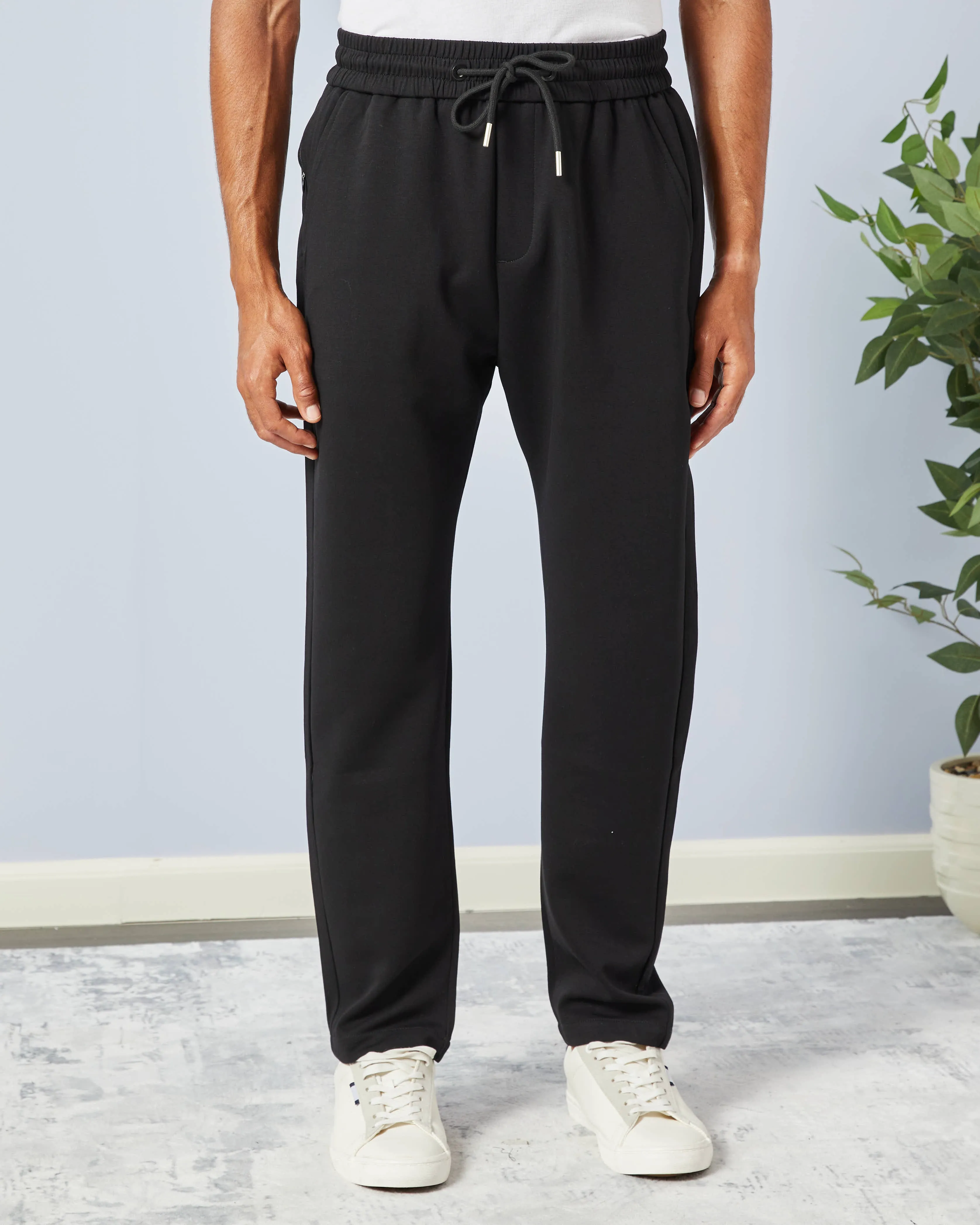 Men Black Solid Active Pants sold by Redtag