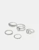 Women Silver Embellished Ring Set (Pack of 5) sold by Redtag