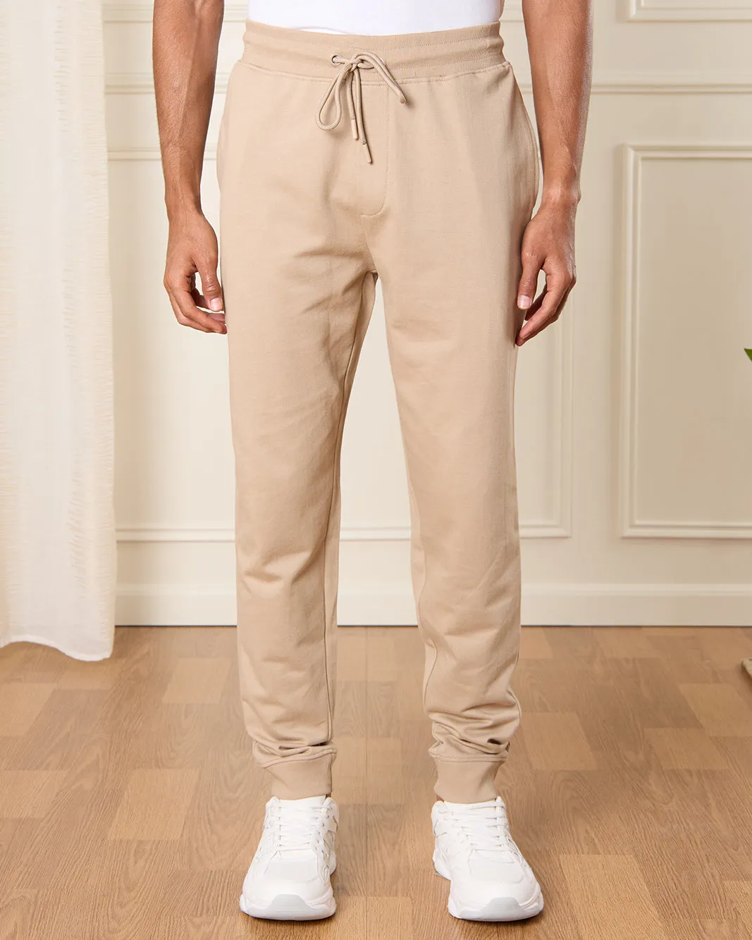 Men Beige Solid Active Pants sold by Redtag