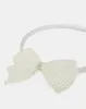 Women Silver Bow Headband sold by Redtag