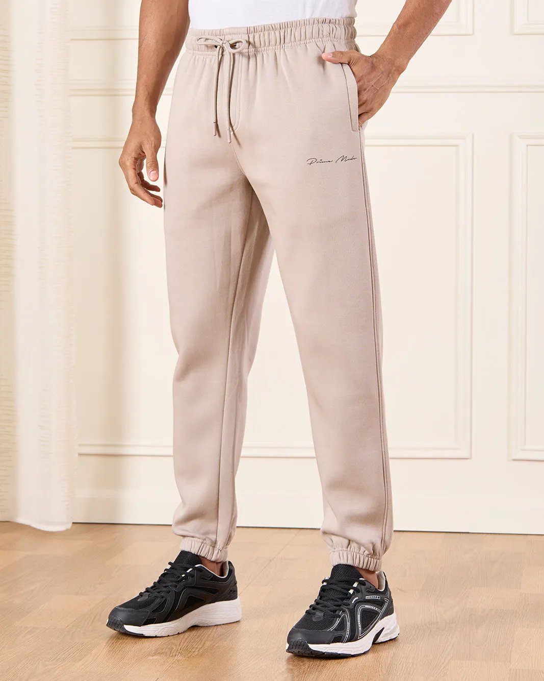 Men Beige Basic Track Pants With Logo Print sold by Redtag