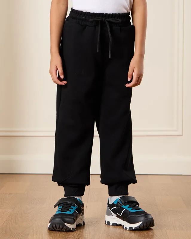 Boys Black Solid Active Pants sold by Redtag