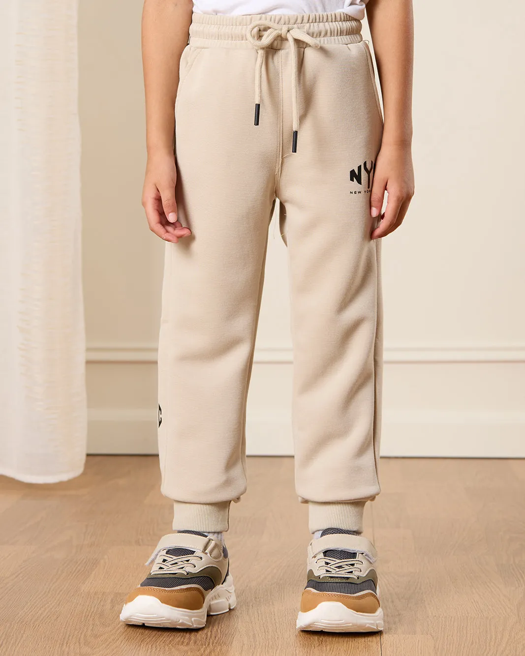 Boys Beige Printed Track Pants sold by Redtag