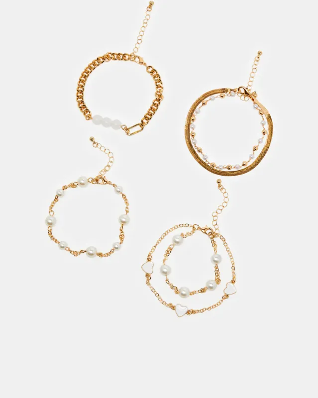 Women Gold Embellished Anklet Set (4 Pieces ) sold by Redtag