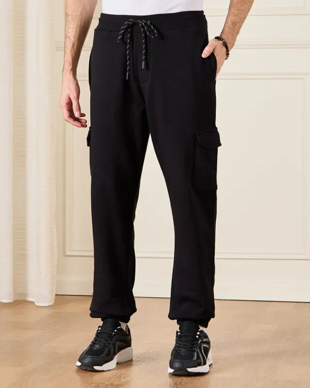 Men Black Solid Active Pants sold by Redtag