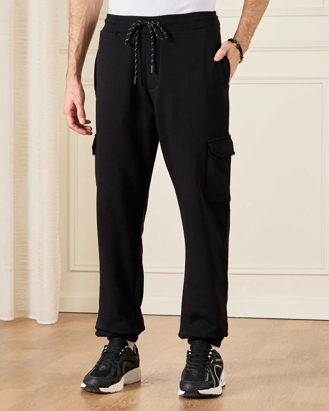 Men Black Solid Active Pants sold by Redtag