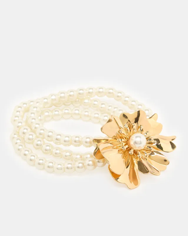 Women Gold Pearl Bracelet sold by Redtag