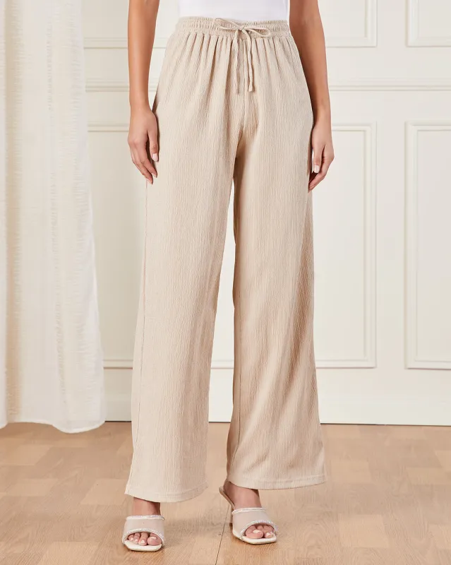 Women Beige Textured Pull On Trouser sold by Redtag