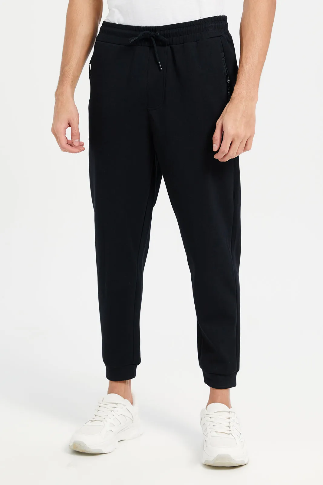 Men Black Solid Active Pants sold by Redtag