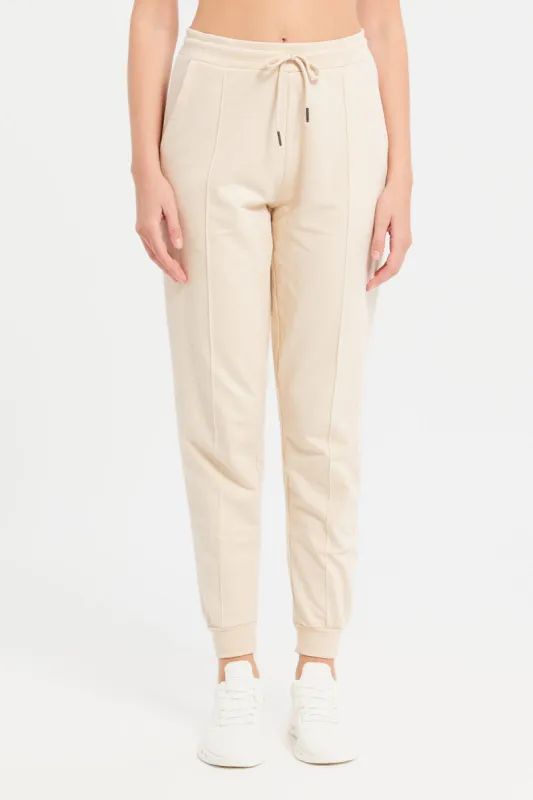 Women Beige Solid Jogger Pants With Pockets sold by Redtag