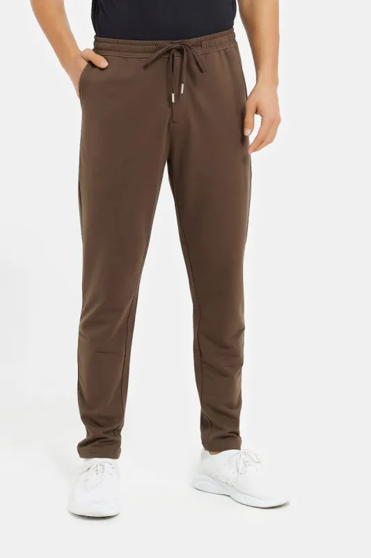 Men Brown Jogger Fit Trousers sold by Redtag