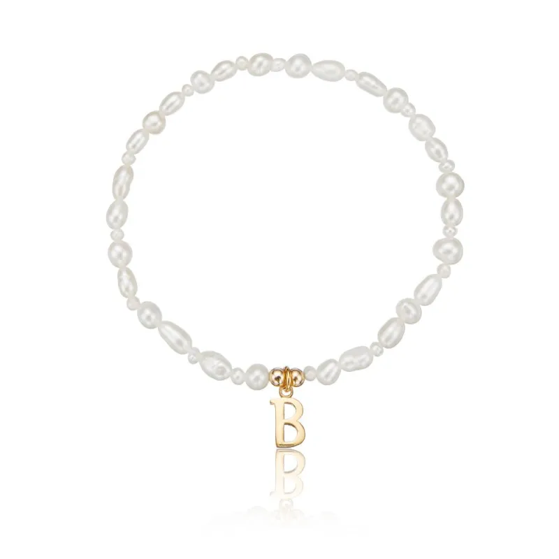 Gold Pearl Initial Letter Bracelet sold by Lily & Roo