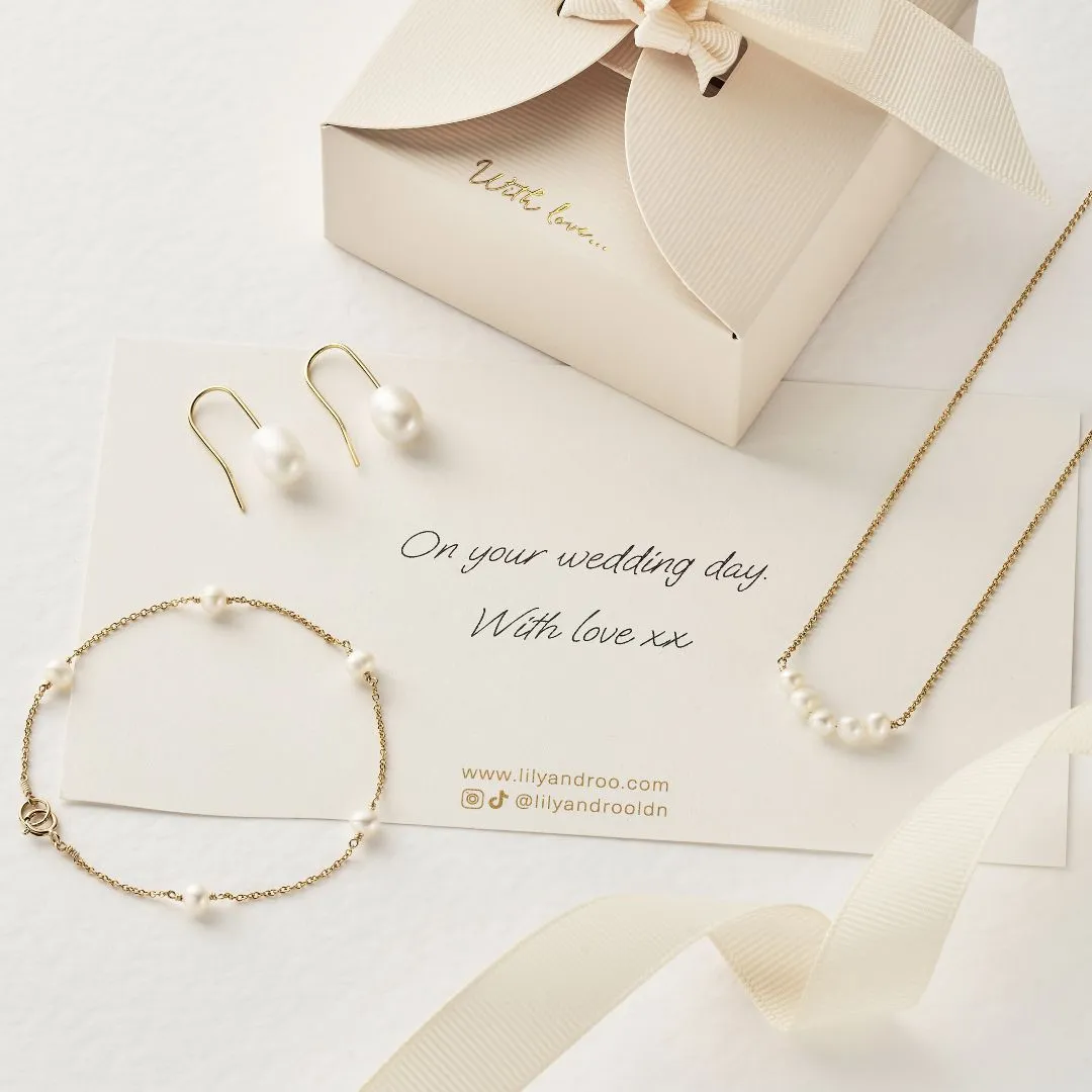 Gold Pearl Drop Hook Earrings sold by Lily & Roo product image thumbnail 4