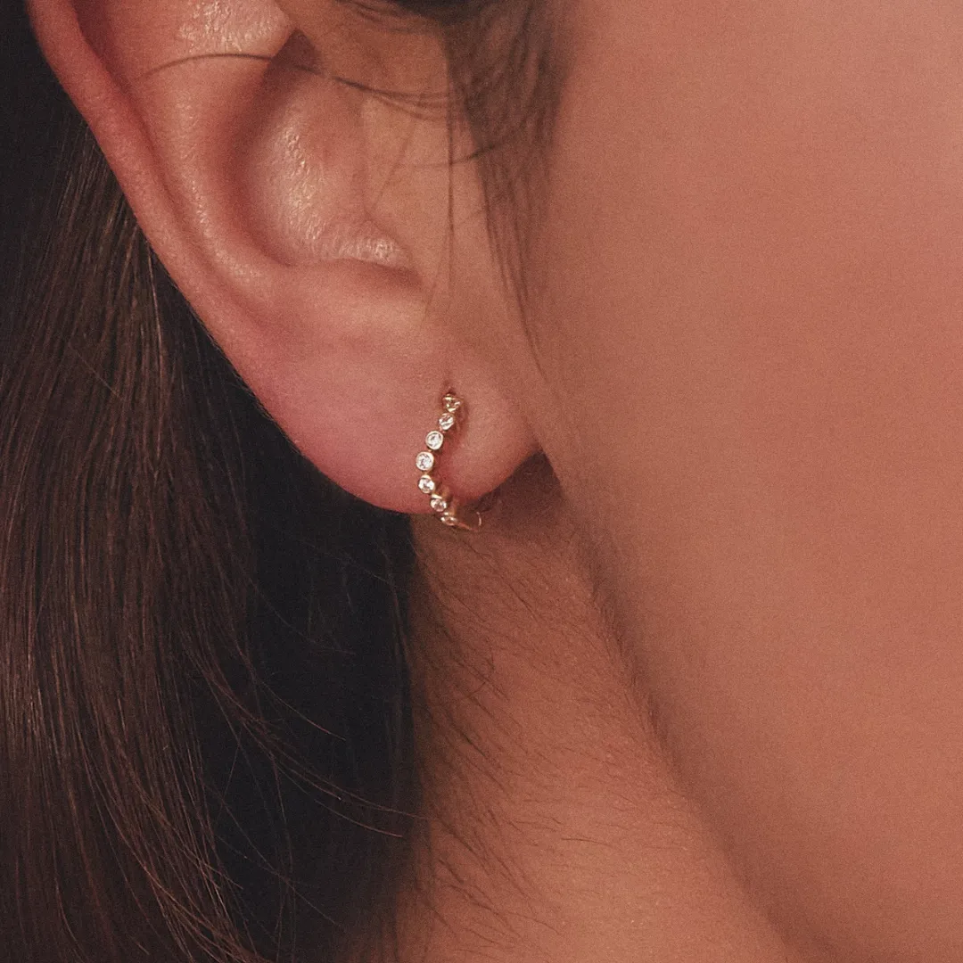 Gold Diamond Style Wave Huggie Hoop Earrings sold by Lily & Roo product image thumbnail 5