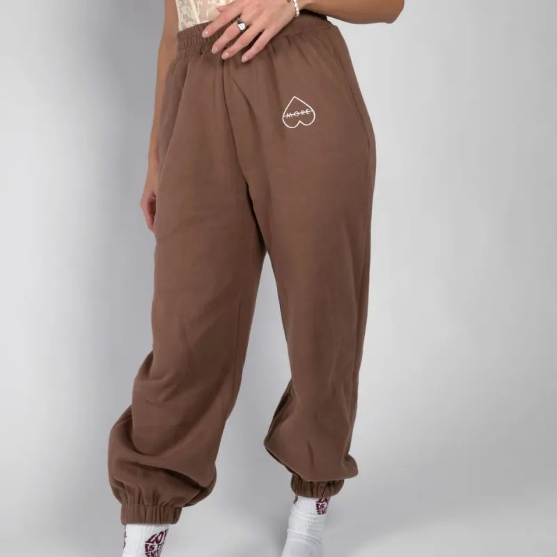 A-MORE Love Is Not Enough - Pantaloni Tuta sold by A-More