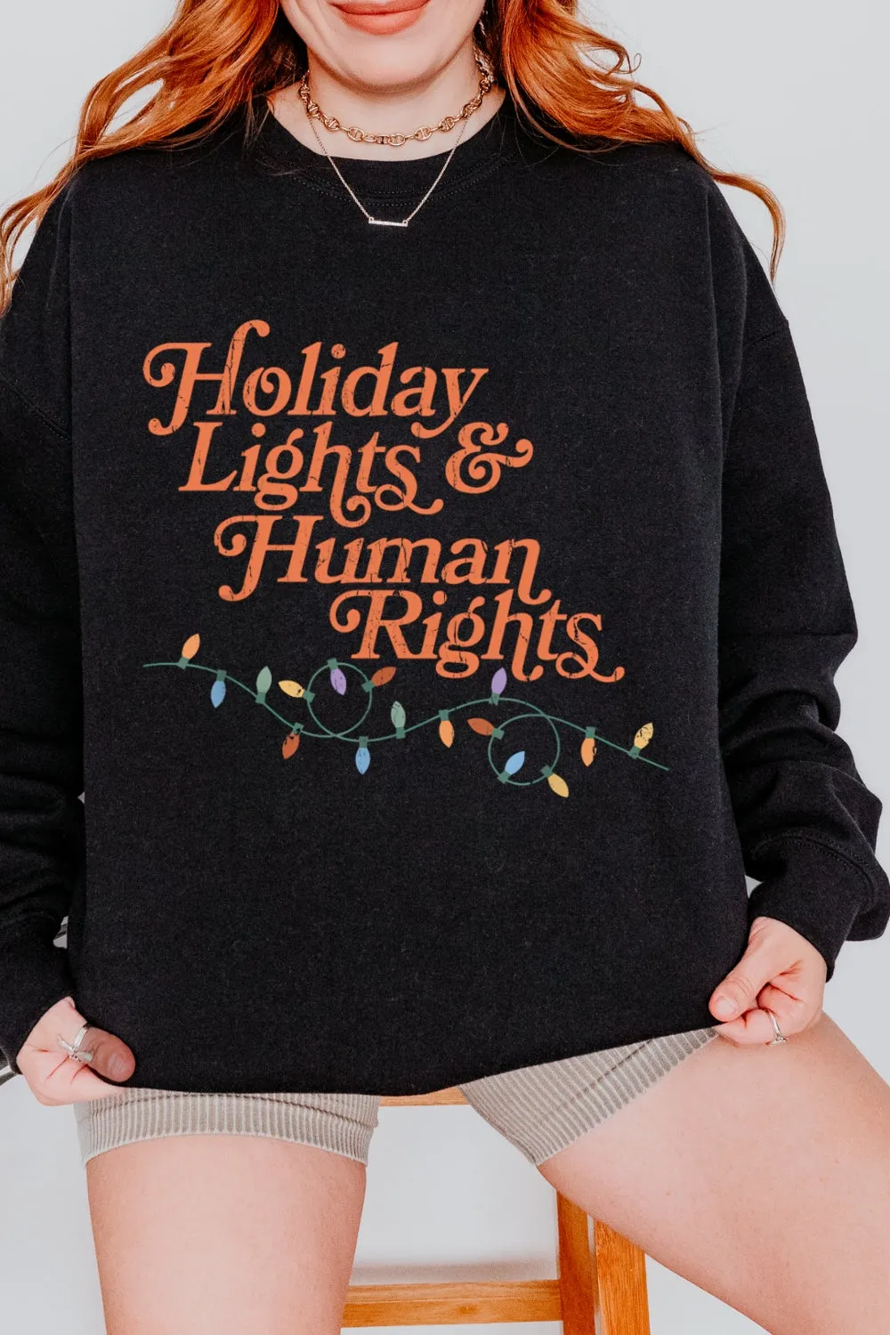 Holiday Lights And Human Rights Sweatshirt For Women sold by Fancy Tees product image thumbnail 5