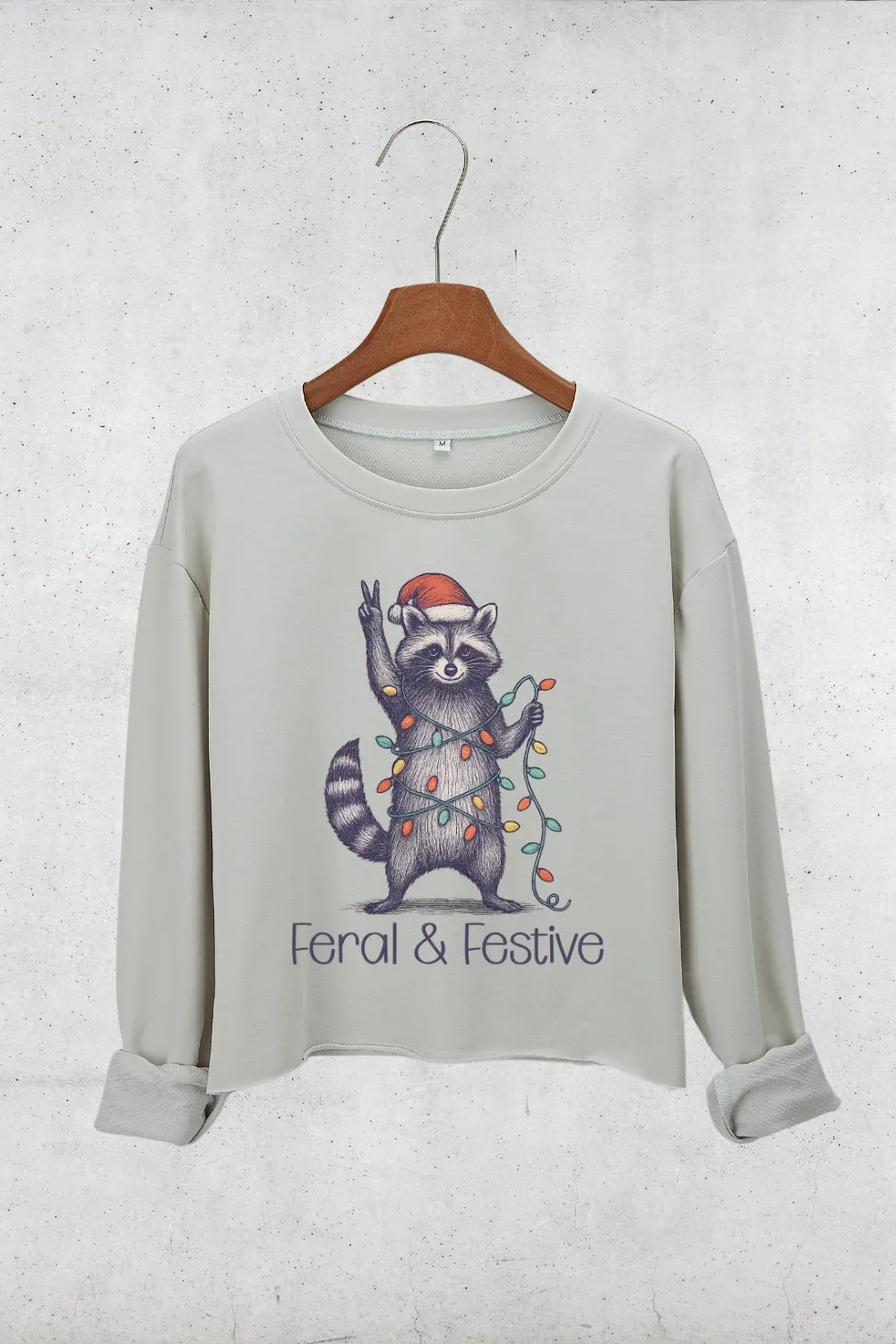 Feral and Festive Christmas Raccoon Crop Sweatshirt For Women sold by Fancy Tees