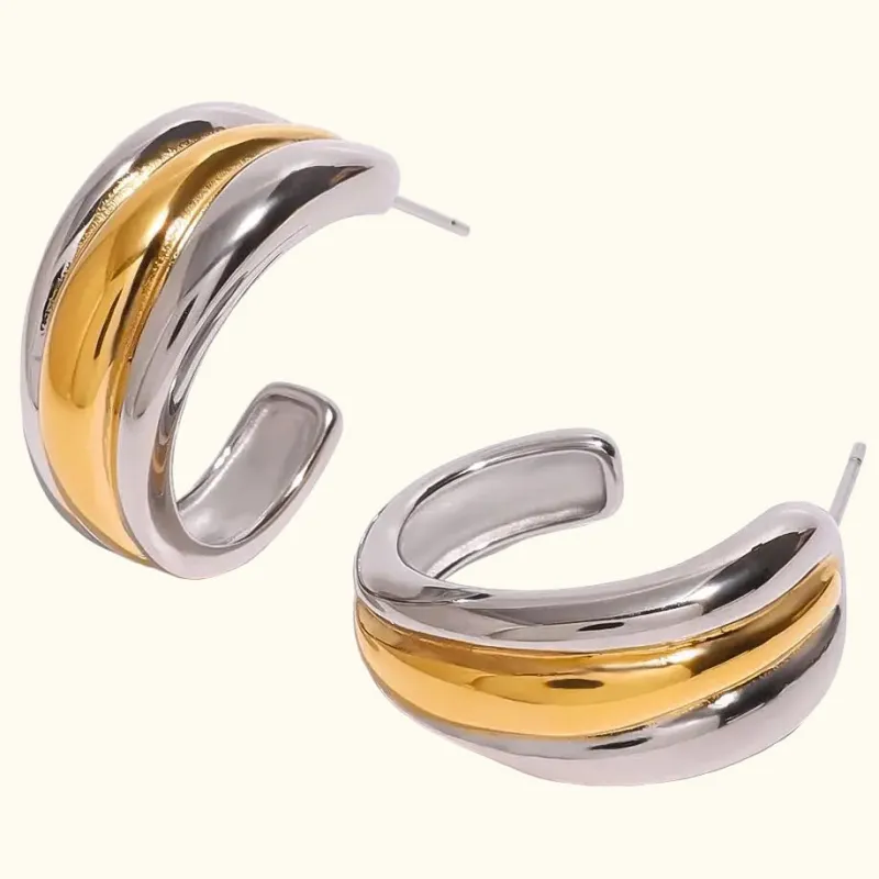 Dual-Tone Crescent Hoops sold by Elleexist