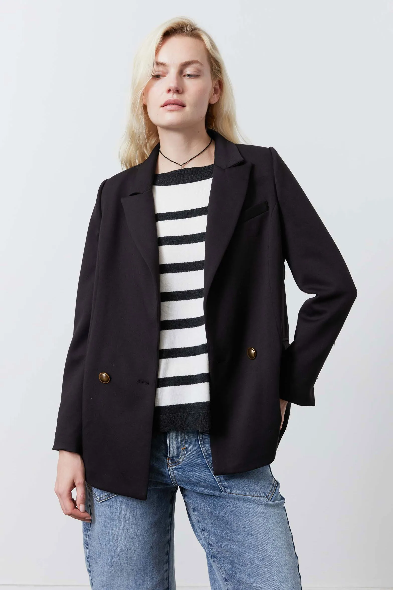 The Stretch Suit Relaxed Double Breasted Blazer sold by Ruti