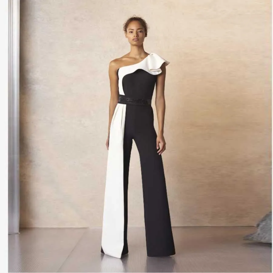 The Monochrome Muse | Black & White Contrast Sleeveless Slim-Fit Jumpsuit sold by Negative
